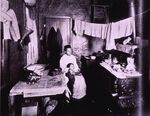 Mother and child in a New York City tenement, ca. 1909. Via the National Library of Medicine.