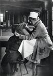 Lice inspection at Ellis Island quarantine station, 1920s. Via the National Library of Medicine.