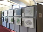 Room divider with posters of "Places and Spaces" exhibit