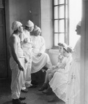 Coffee klatch outside an operating room, Rome, 1944. Via Galter Special Collections.