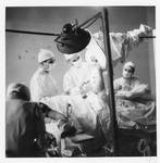 Performing a leg operation, Rome, 1944. Via Galter Special Collections.